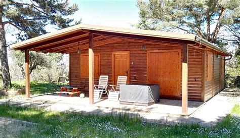 500 m² 4 dormitorios 2 baños. Casa de madera de 55 m2 con porche de 20 m2 barata