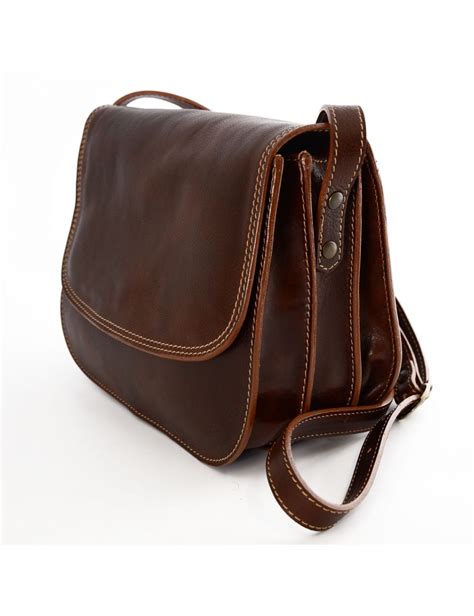 It comes with an adjustable long 60 shoulder strap to comfortably fit the tall and the short and there is a sliding rubber. Woman Genuine Leather Shoulder Bag with 3 compartments - Annie