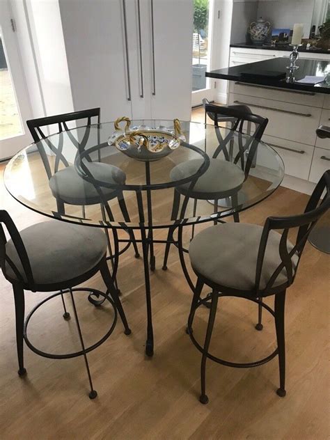 Sourcing guide for toughened glass table top: Bargain! Glass high top dining table and 4 swivel chairs ...