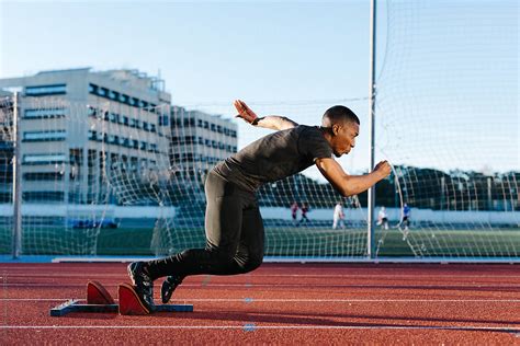 Black Man Running Fast On Stadium By Stocksy Contributor Javier Díez