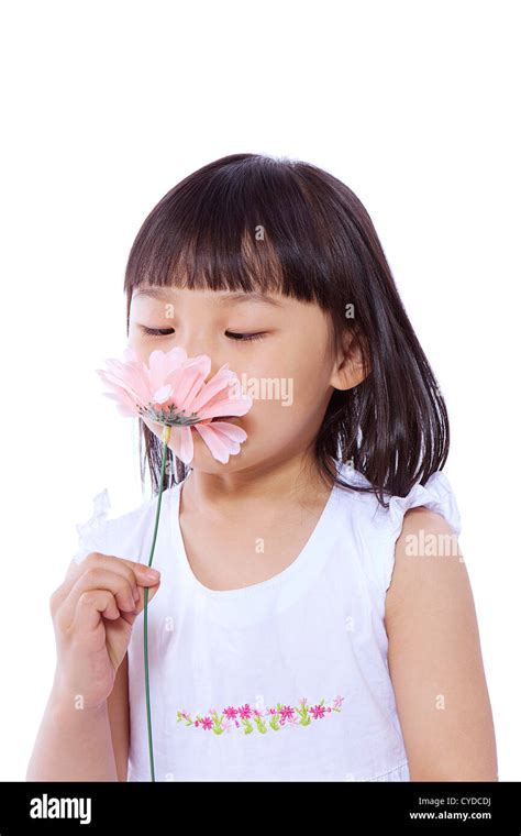 A Little Girl Smelling Flowerportrait Stock Photo Alamy