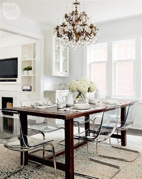 The chair legs, though brass, have the same honeyed tones as the wood of the table, which helps them cohere. Ikea Ghost Chairs - Transitional - dining room - Style at Home