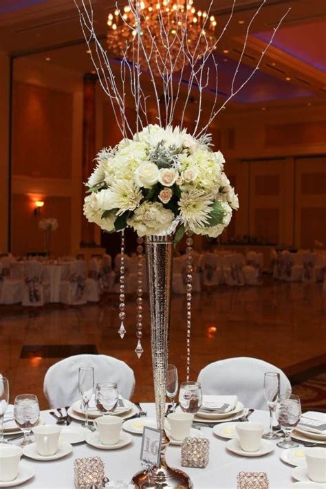 Winter Wedding Centerpiece On Tall Silver Vase With Silver