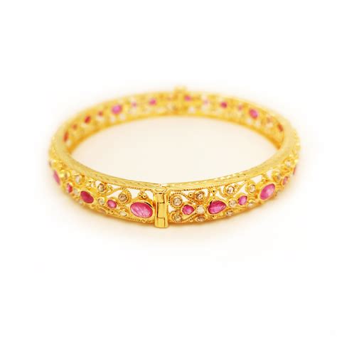 The collection has bangles in the most alluring designs.the gold bangle design catalogue features certified diamonds. 916 Yellow Gold Diamond Ruby Bangle - ValueMax Jewellery
