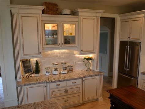 The kitchen is open to the dining and living rooms, but doesn't have a lot of natural light. Kitchen Cabinet Facelift