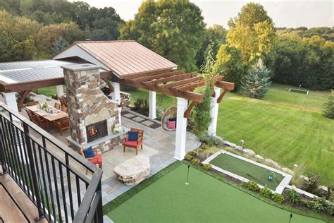 Elevated Backyard With With Pergolas And Putting Green Hgtvs