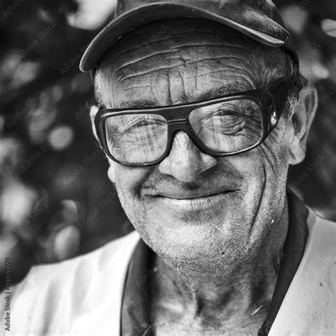 Portrait Of Smiling Old Man With Wrinkled Face Black And White