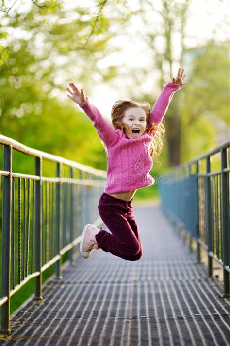 Funny Little Girl Jumping With Joy And Happines Stock Image Image Of