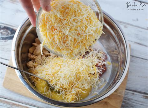 This dorito casserole is loaded with chicken, cheese, and a whole bag of nacho cheese doritos! Cheesy Dorito Chicken Casserole Recipe - BubbaPie