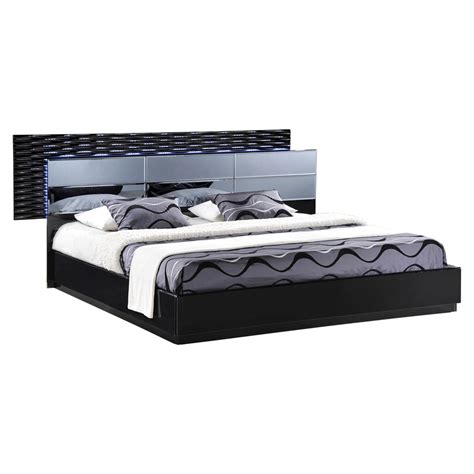 With its clean angled lines and unique combination of a high gloss black surface with smoked mirrored panels this set will instantly transform you living space. Manhattan Bedroom Set in High Gloss Black | DCG Stores