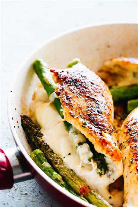 Asparagus stuffed chicken parmesan is an easy, healthy dinner recipe thats keto friendly, low carb, gluten free and ready in 30 minutes. Cheesy Asparagus Stuffed Chicken Breasts Recipe - Cravings ...
