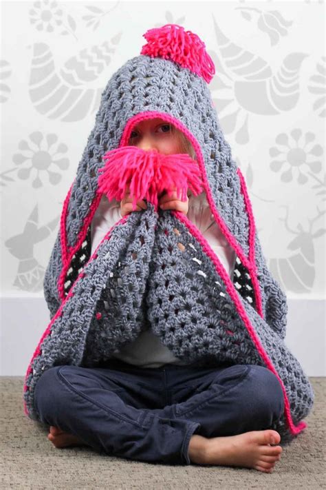 Based On A Large Granny Square The Granny Gives Back Crochet Hooded Blanket Pattern Makes An