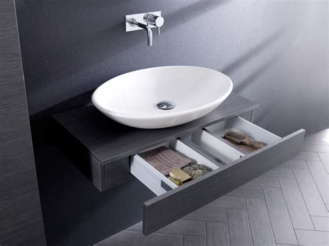 Minimalist style with with natural elements and clean lines, this floating this bathroom vanity set features a stunning integrated basin and countertop with smooth lines and a thick profile. Bauhaus Bathroom Furniture - SquareMelon SquareMelon