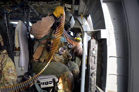 An Air National Guard Airman Loads A Belt Of Rounds Into A Gau 2