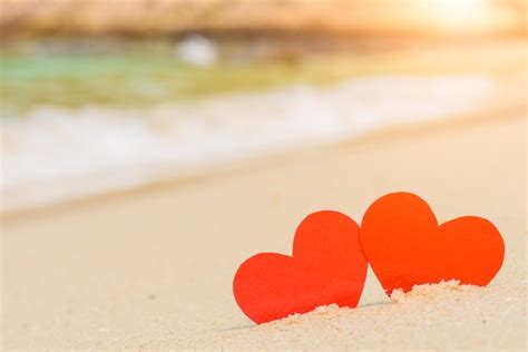 Premium Photo Two Red Hearts On The Summer Beach Love Wedding And