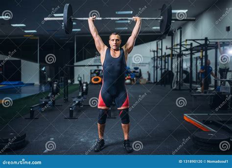 Powerlifter Doing Weightlifting Exercise Man With Naked Torso Lifting Weights Stock Photography