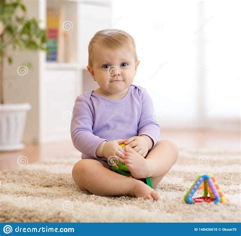 Cute Funny Baby Sitting On Carpet At Home Stock Photo Image Of Carpet