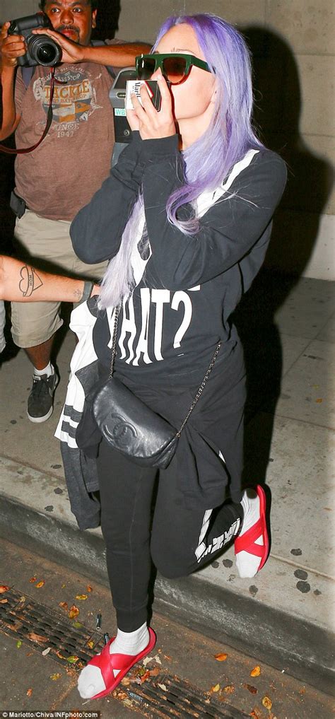 Amanda Bynes Steps Out With Purple Hair As She Checks Into Hotel