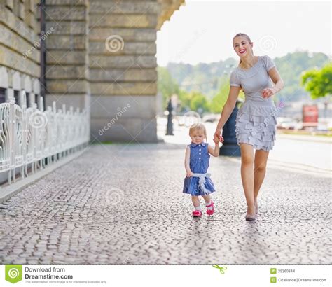 Mother And Baby Walking In City Stock Images Image 25260844
