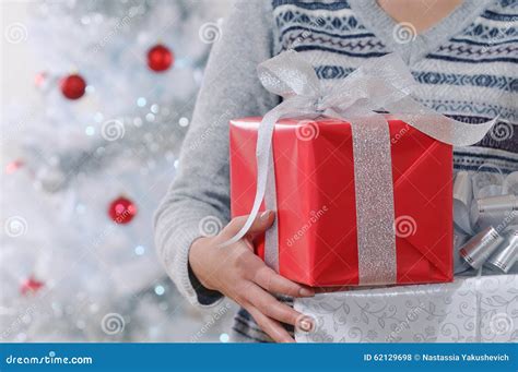 Cropped Shot Of Woman Holding Wrapped Christmas Gifts Stock Photo