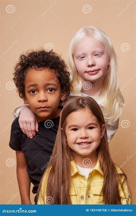 Adorable Kids Of Diverse Nationalities And Skin Colors Stand Together