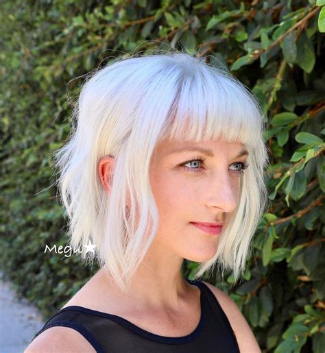 Check Out This Platinum Blonde Bob The Platinum Color And Short Bangs Gives This Look A Modern