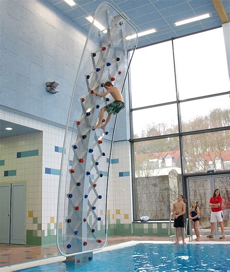 Residential climbing walls let climbers scale the walls in their rec rooms, bedrooms and home gyms. AquaClimb Poolside Climbing Wall