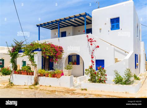 White Typical Greek House On Street Of Naoussa Town Paros Island