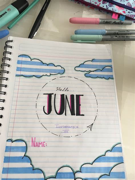 An Open Notebook With The Words June Written On It Next To Some Markers