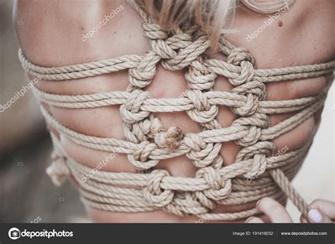 Woman Bound With A Rope In Japanese Technique Shibari Stock Photo By