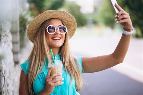Free Photo Happy Woman Drinking Coffee And Doing Selfie