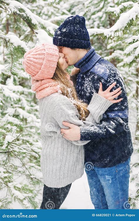 Happy Couple Kissing In Winter Forest And Snowfall Stock Image Image