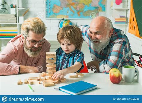 Father And Son With Grandfather Was Excited With Playing Game
