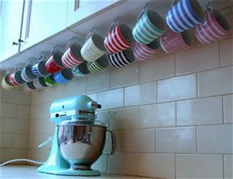 Mug hooks, also known as cup hooks, provide extra storage space for coffee and tea cups, freeing up valuable cupboard space in the process. Clever mug storage under cupboards ~ this would free up a ...