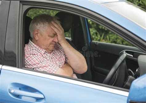 Mature Man Driving In His Car Looking Fed Up Stock Photo Image Of