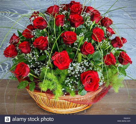 Beautiful Red Roses Bouquet Against Wooden Background Stock Photo Alamy