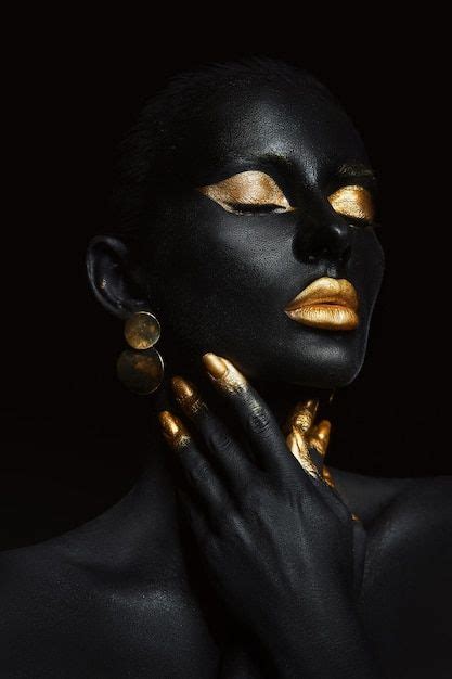 Premium Photo Beauty Woman Painted In Black Skin Color Body Art Gold Makeup Lips Eyelids