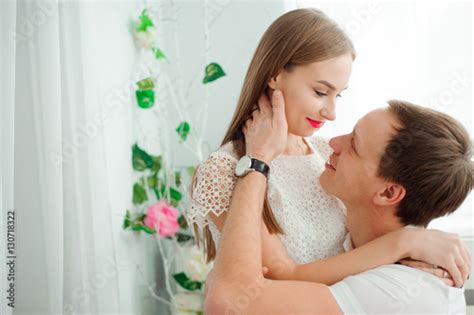 A Young Husband And Wife Hug Each Other Stock Photo Adobe Stock