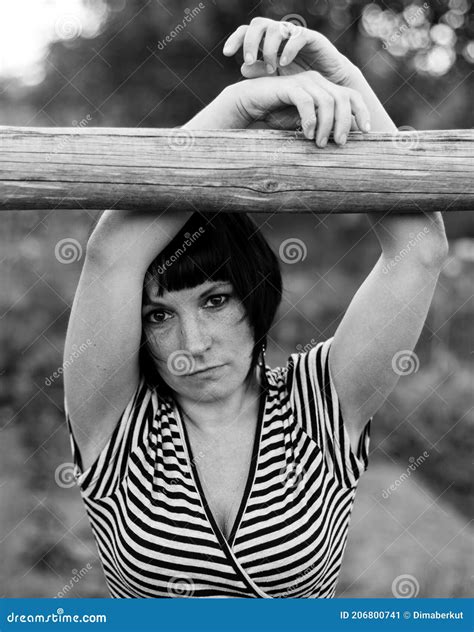 Black Haired Woman Outdoors In The Village Black And White Photo