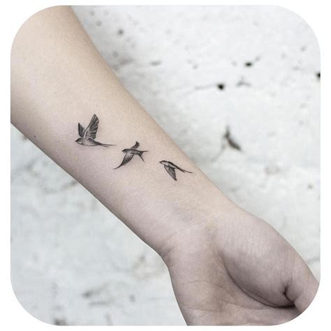 Small Tattoo Models Swallows Flying To The Sky In Black And White On