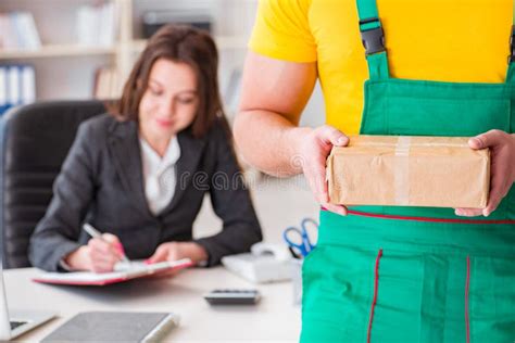 The Postman Delivering Parcel To The Office Stock Image Image Of