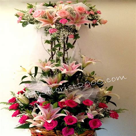 There are plenty of beautiful brightly colored flowers such as anthuriums, gerberas, lilies, mokara orchids, and roses that can be arranged for a grand opening stand. Flowers To Singapore-Florist-Flower Shop
