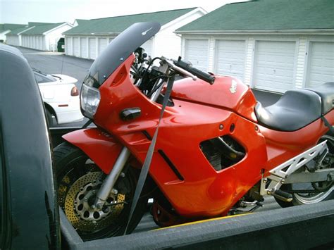 Best not to place the motorcycle on it's centre or side stands when tying it down on a trailer. Proper way to strap down a motorcycle in the bed of a ...