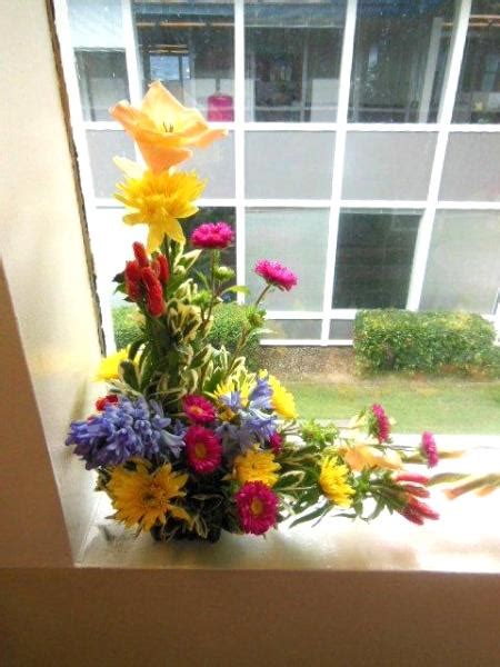 L Shaped Flower Arrangements Displayed At Window Side California