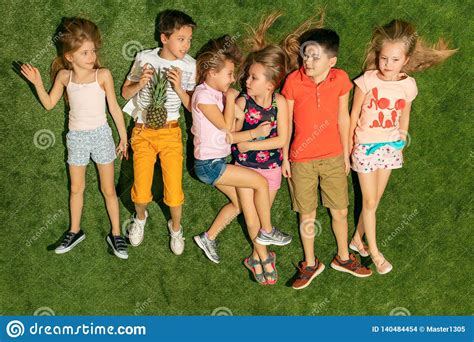 Group Of Happy Children Playing Outdoors Stock Photo Image Of Love