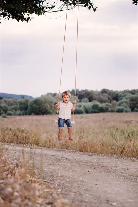 Happy Young Boy Playing On Swing In A Park Stock Image Image Of Happy