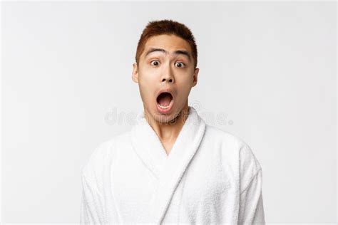 Beauty Spa And Leisure Concept Portrait Of Amazed Startled Asian Man Open Mouth Hear Amazing