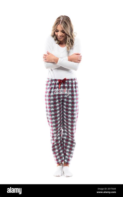 Cute Young Cuddly Woman In Comfy Pajama Hugging Herself Smiling Feeling