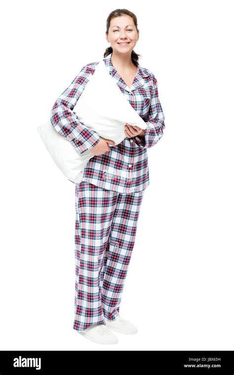 Smiling Beautiful Girl In Pajamas And Slippers Hugging A Pillow On A White Background Stock
