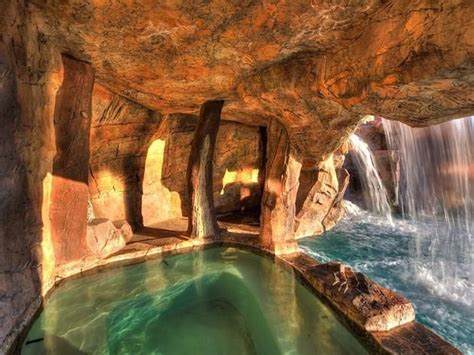 Cave Like Spa Behind Waterfall Surrounded By Stone Walled Grotto Lazy